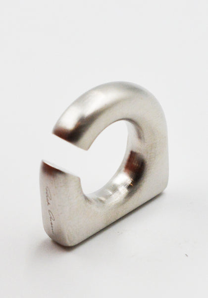 RICK OWENS MEN ROUND PRONG EAR CUFF PALLADIO SS26 | DOSHABURI Shop